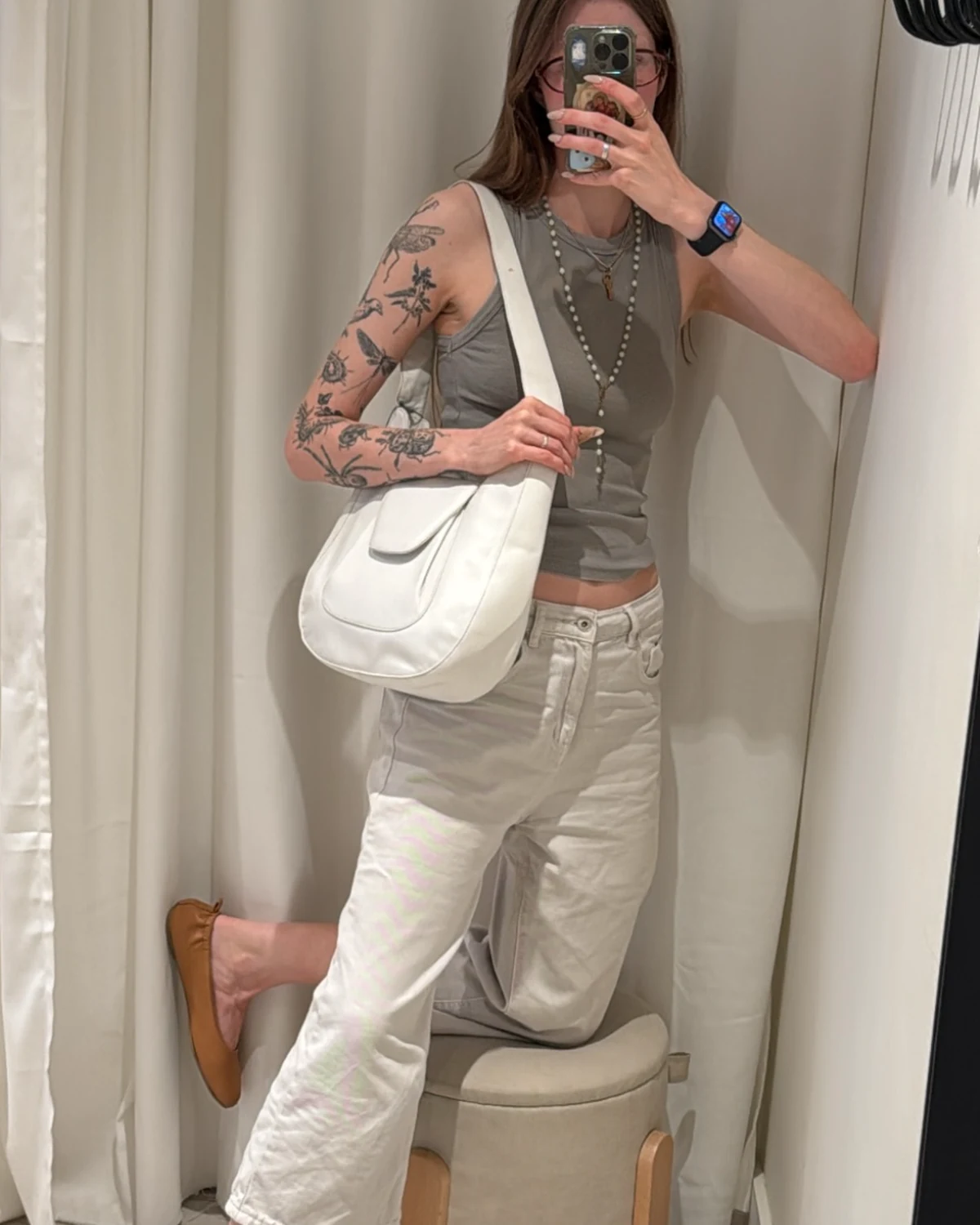 White Franco Celin shoulder bag worn by a model